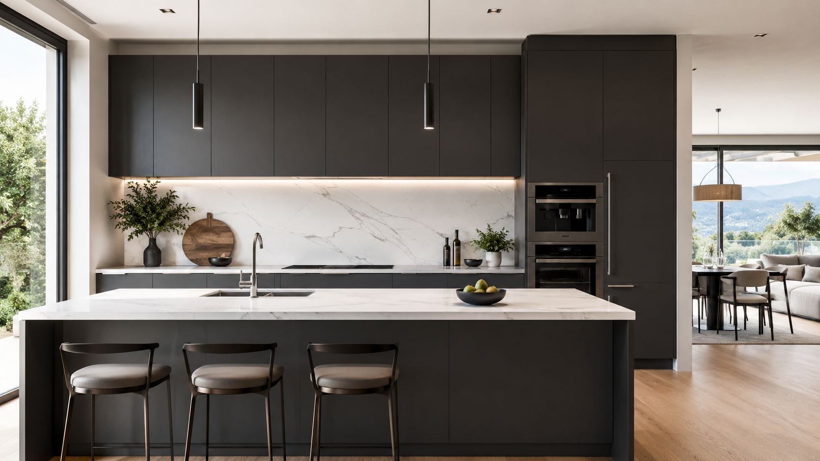 A modern kitchen interior featuring dark grey cabinets, a marble island countertop, and high-quality stainless steel appliances.